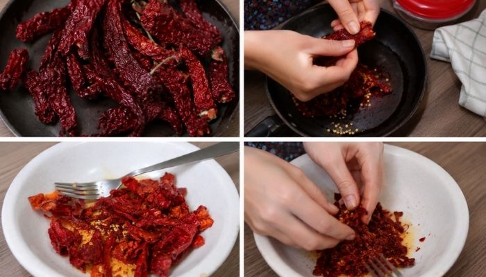Peperoni cruschi fritti e frantumati a mano durante la preparazione